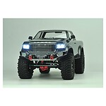 Off-road RC truck with LED headlights, rugged tires, and detailed exterior for RC car enthusiasts.