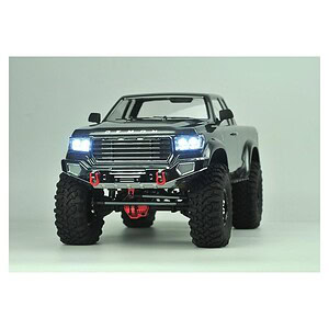 Off-road RC truck with LED headlights, rugged tires, and detailed exterior for RC car enthusiasts.