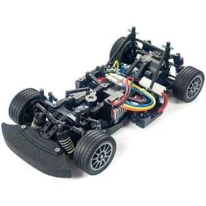 High-performance RC car chassis with brushless motor and off-road tires.