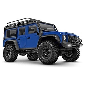Blue RC off-road vehicle with rugged tires and roof rack.