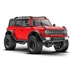 1/18 TRX-4M Scale and Trail Crawler with Ford Bronco Body 4WD Electric Truck - Red 97074-1-RED - 97074-1-trx-4m-bronco-3qtr-front-red__80829 Red RC off-road monster truck with large tires and rugged design, perfect for RC car enthusiasts.