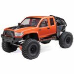 Off-road RC truck with large tires and rugged design for remote control racing and crawling.