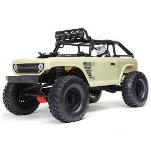 Off-road RC car with large tires and detailed exterior, perfect for rugged terrain.