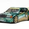 Vintage RC racing car in green with gold accents, racing decals, and spoiler, RC car enthusiasts can appreciate the detailed scale model.