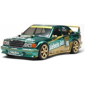 Vintage RC racing car in green with gold accents, racing decals, and spoiler, RC car enthusiasts can appreciate the detailed scale model.