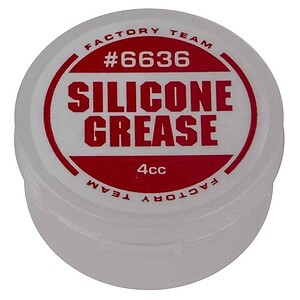 A small container of silicone grease for RC car maintenance, ideal for lubricating moving parts and ensuring smooth performance.