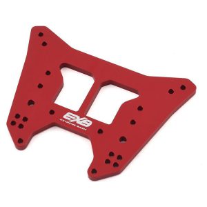 Red aluminum RC car chassis for off-road racing and stunt performance.