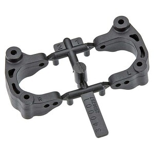 Black plastic RC car upper chassis with mounting holes and stabilizer.
