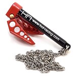 Close-up of RC car chain with red metal chain tensioner and black shock absorber with website link.