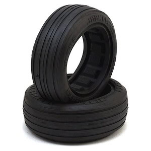 Durable black rubber tires for remote control cars, ideal for off-road racing and smooth pavement.