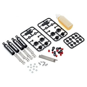 RC car repair parts kit with shock absorbers, screws, and lubrication oil.