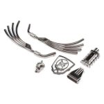 High-quality RC car metal parts for upgrades and repairs, including exhaust, gear, and skull accents.