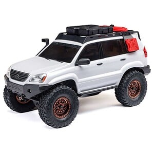 Detailed RC off-road vehicle with rugged tires and accessories.