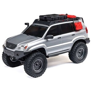 Highly detailed RC off-road vehicle with large tires, roof storage, and rugged design. Perfect for RC car enthusiasts and off-road racing.