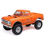 Detailed orange RC off-road truck with realistic wheels and decals. Perfect for RC car enthusiasts and hobbyists.