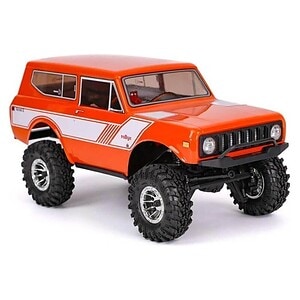 Detailed image of an RC off-road vehicle with large tires and rugged chassis.