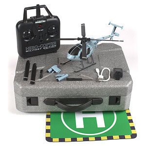 Remote control helicopter with accessories, batteries, and charging equipment for RC car enthusiasts.