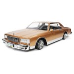 Vintage brown luxury sedan diecast model car for collectors.